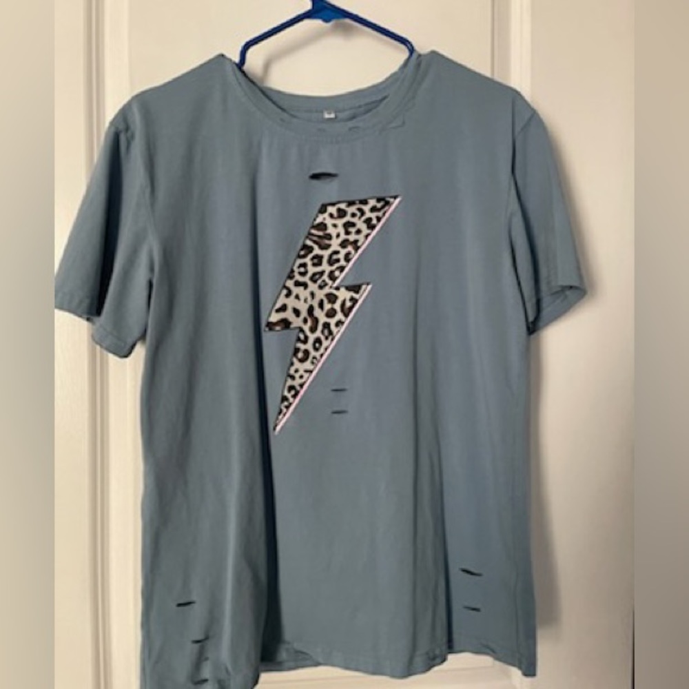 blue shirt with cheetah lighting bolt